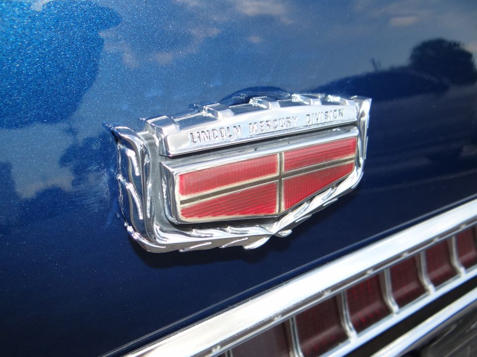 The trunk emblem is almost as rare as the front for the opposite reason.  It was used all the way up to 1978 and it is fragile.  It has the sliding door for the key lock to the trunk.  I found one NOS as a backup, but far from cheap..