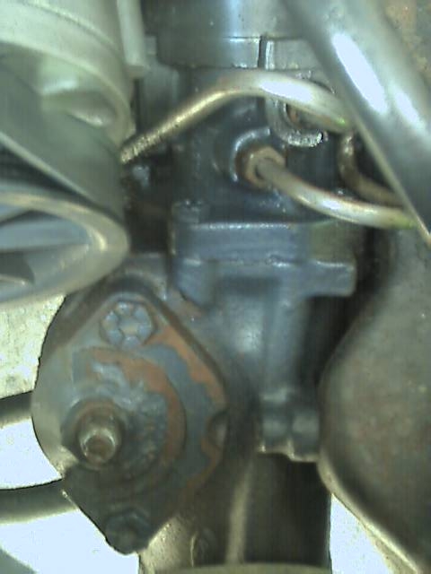 1989 Ford Bronco - This is a close-up view of a power steering component, likely from a vehicle's engine bay.