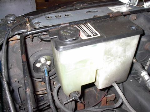 1986 Ford Bronco - Washer/coolant resevoir relocated to front. Note 12 gauge wires to headlights