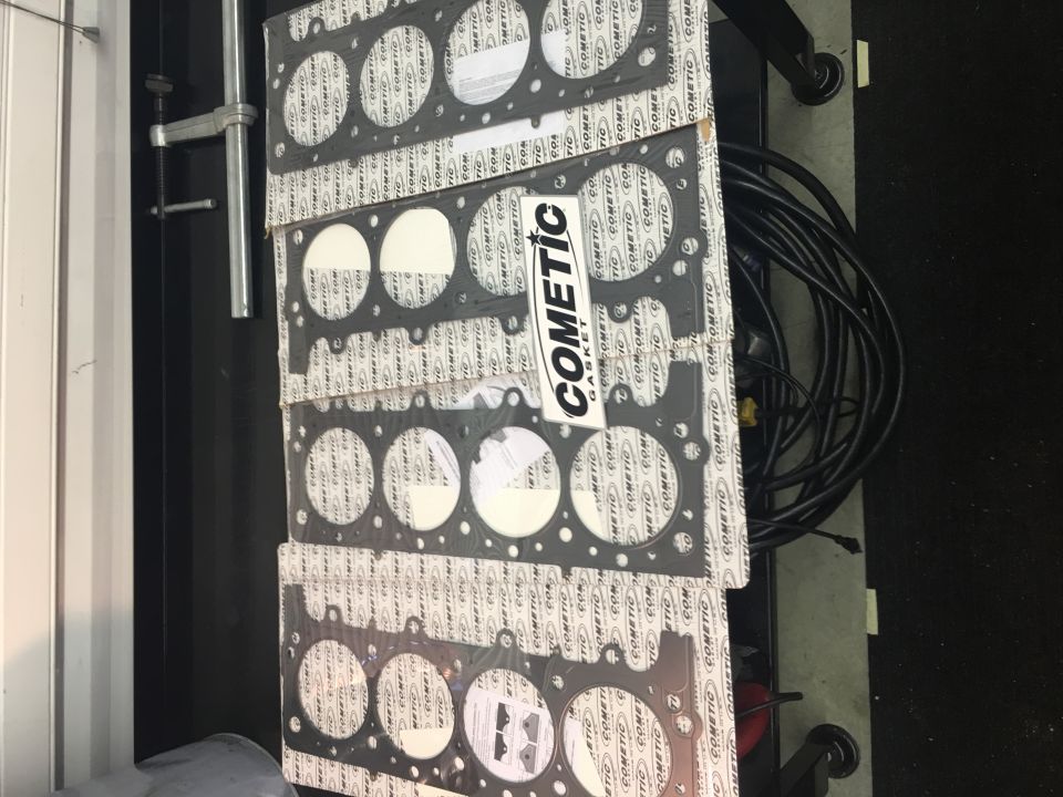 Stack of Cometic Gasket head gaskets with circular cutouts