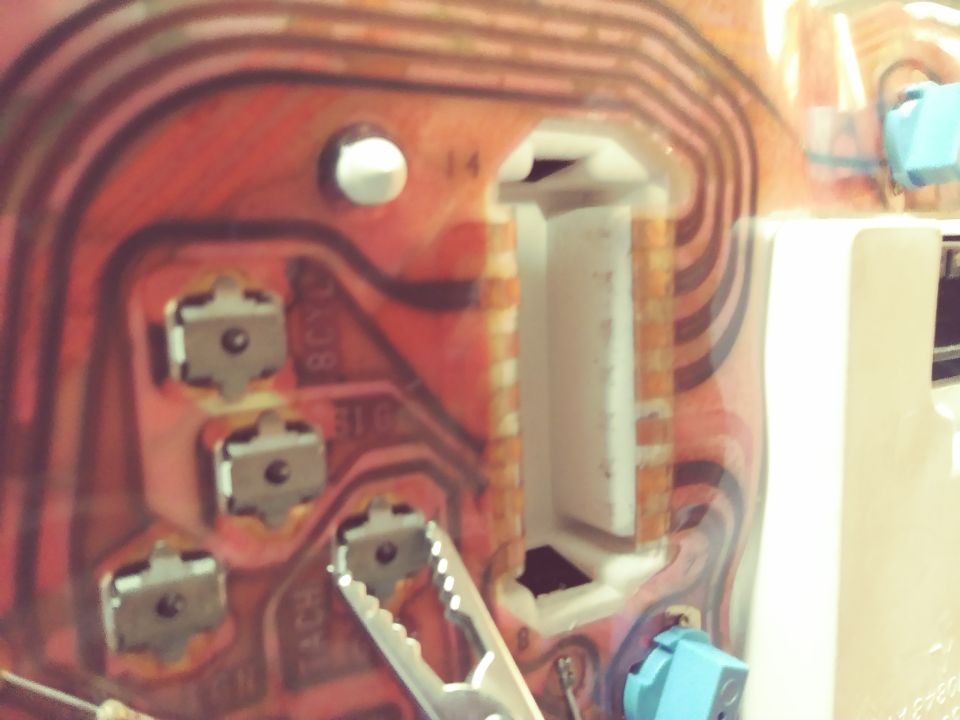 Close-up of a circuit board with multiple connectors and traces. Some text is visible