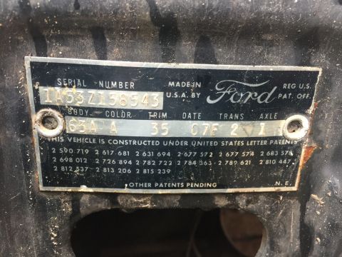 1961 Ford Starliner - Close-up of a Ford VIN plate, showing serial number and manufacturing details.