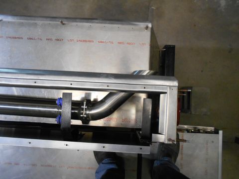 1992 Ford Bronco - A custom exhaust system component is shown, with visible lot numbers stamped on the metal casing.