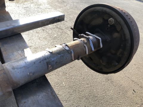 1986 Ford Bronco - This is a close-up view of a rear axle assembly, likely undergoing modifications or repairs.