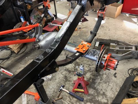 1992 Jeep Wrangler - Close-up view of vehicle suspension and drivetrain components undergoing maintenance or modification.