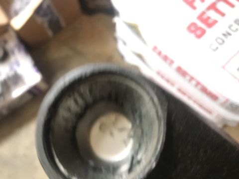 1989 Ford Bronco - A metal component is shown next to a container with visible text.