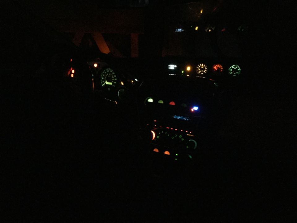 car interior at night with dashboard lights on