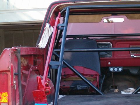 1979 Ford Bronco - Interior view of a 1979 Ford Bronco with a custom roll cage installed.