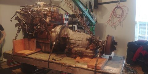1996 Ford Bronco - 20190801 - I get the chain adjusted, shift the weight of the engine more toward the right leg, and voila! Finally get the dang thing off an…