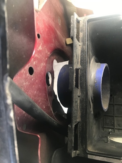 2000 Ford Explorer - This image shows a close-up view of an air intake system component, likely part of a vehicle's engine bay.