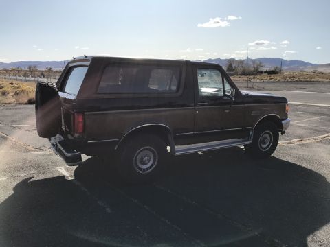 1988 Ford Bronco - This 1988 Ford Bronco is shown from the side with a spare tire mounted on the rear.