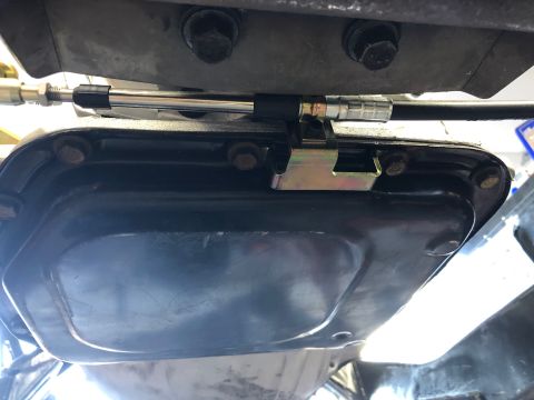 1992 Jeep Wrangler - Underside view of a transmission pan with a cable assembly. The registry claims it is a 1992 Jeep Wrangler.