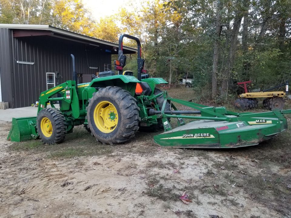 The loader was the previous year model installed at the dealership. The mower was bought (heavily) used, as were the disk & blade.