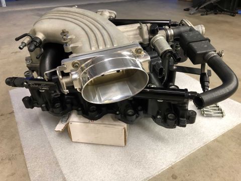 1998 Ford Crown Victoria - Engine intake manifold and throttle body assembly with fuel rails and hoses attached.