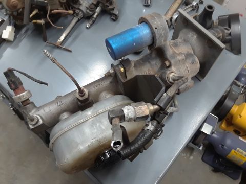 1994 Ford Bronco - Brake master cylinder assembly with visible part numbers and hoses.