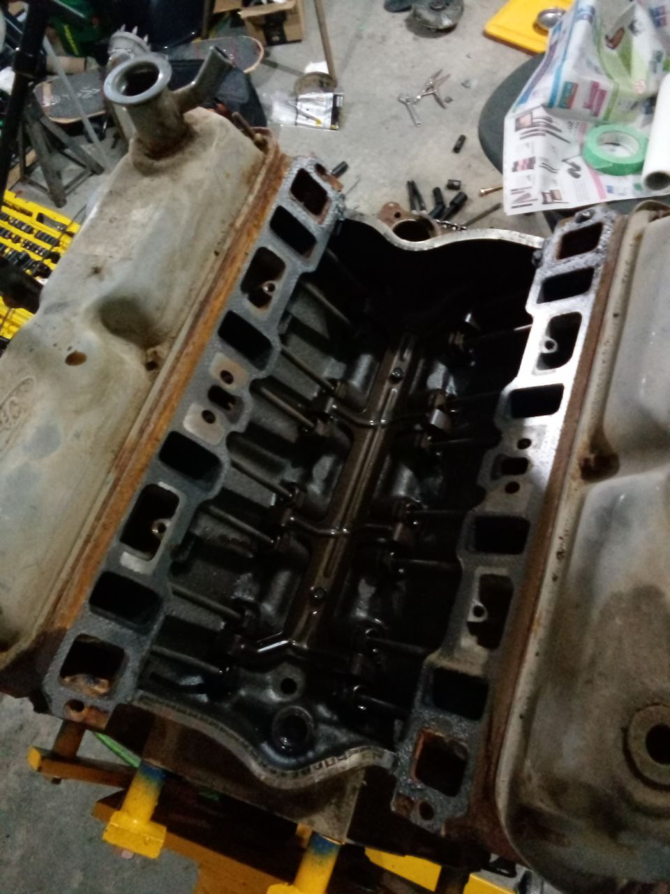 Engine block with open intake ports and visible valve train components