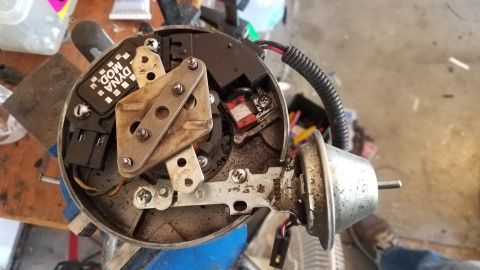 1985 Ford Bronco - Automotive ignition distributor part with 'DYNA MOD' label, likely for an older vehicle.