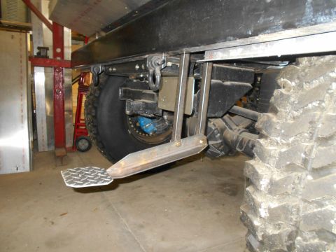 1992 Ford Bronco - Custom step assembly mounted to the frame of a heavy-duty vehicle.