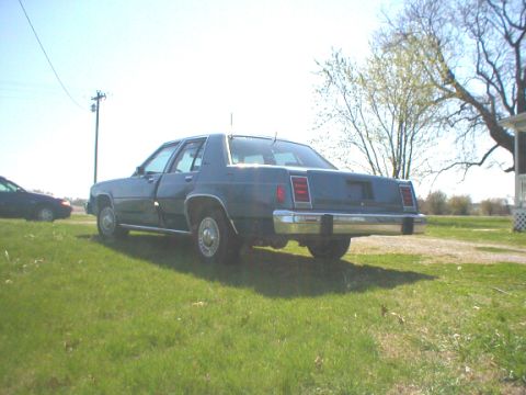 1987 Ford Crown Victoria LTD - Rear view of a blue 1987 Ford LTD Crown Victoria with a chrome bumper.