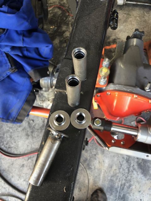 1992 Jeep Wrangler - Close-up of frame and suspension components, including threaded sleeves and washers, during a vehicle build or repair.