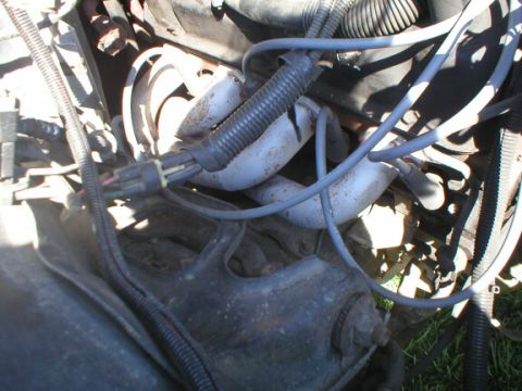 1987 Ford Crown Victoria LTD - Engine bay detail with exhaust manifold and spark plug wires visible.