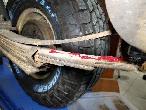 1974 Ford Bronco - Before deciding how bad the shocks are, it's necessary to get the leaves moving, so I spread each leaf and greased them to make the ride sm…