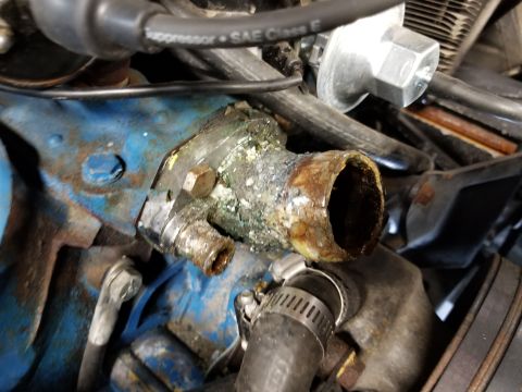 1974 Ford Bronco - After a few months of driving, the coolant leak from the thermostat cover became too severe to ignore. This is just one more reason to hate…