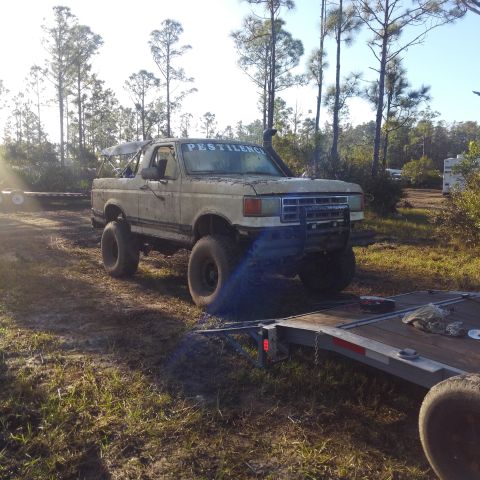 1988 Ford Bronco - This modified 1988 Ford Bronco, nicknamed "Pestilence," is ready for off-road adventures, seen here at a mud park.