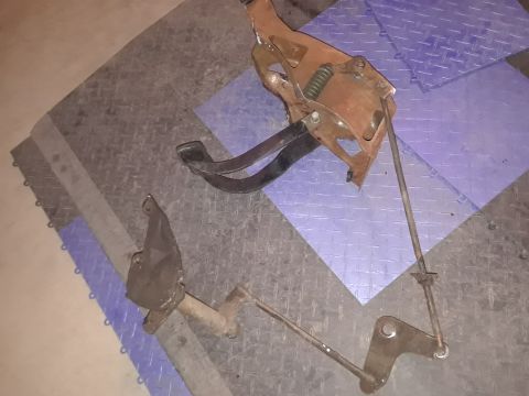 1994 Ford Bronco - These are brake and clutch pedal assemblies, likely removed from a vehicle for repair or replacement.