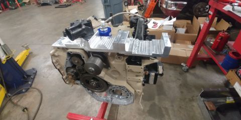 1996 Ford Bronco - 20191115 - Engine still coming together. High mount AC brackets are installed with the 45 degree lower water neck. This is needed to work w…