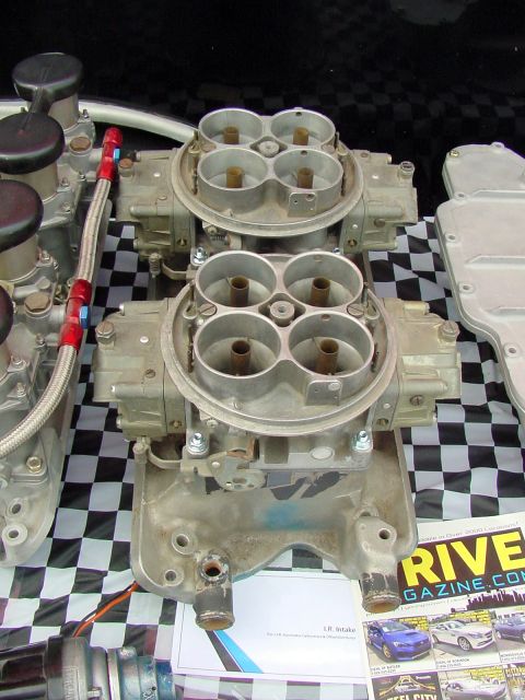 1969 Ford Mustang - A pair of performance carburetors are displayed, suggesting engine upgrades.