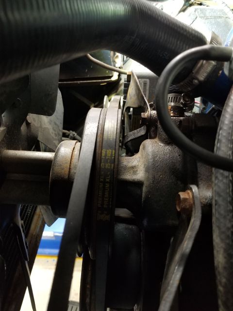 1974 Ford Bronco - After reinstalling the thermostat, I noticed the alternator is mounted slightly too far back, causing the belt to bend. Not a big deal, but…
