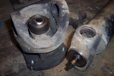 1995 Ford Bronco - Close-up of worn driveshaft parts, showing a damaged U-joint and yoke.