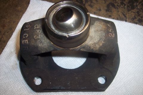 1995 Ford Bronco - Close-up of a driveshaft U-joint yoke, showing stamped markings.