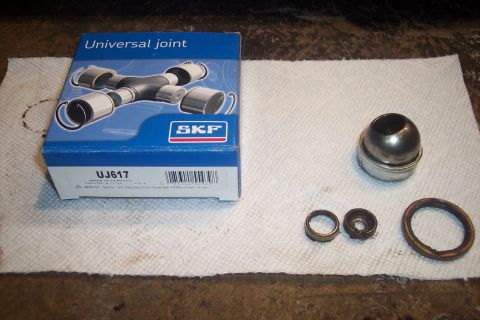 1995 Ford Bronco - SKF UJ617 universal joint parts laid out on a paper towel.