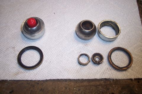 1995 Ford Bronco - Various disassembled vehicle components are laid out on a towel, ready for inspection or replacement.