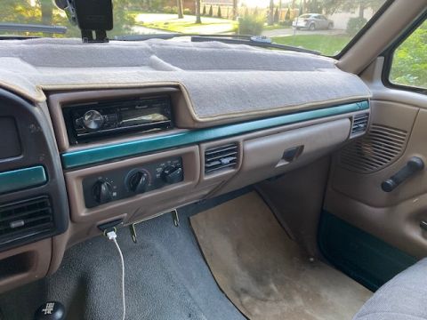 1996 Ford Bronco - Interior view of a 1996 Ford Bronco, the dashboard and center console.
