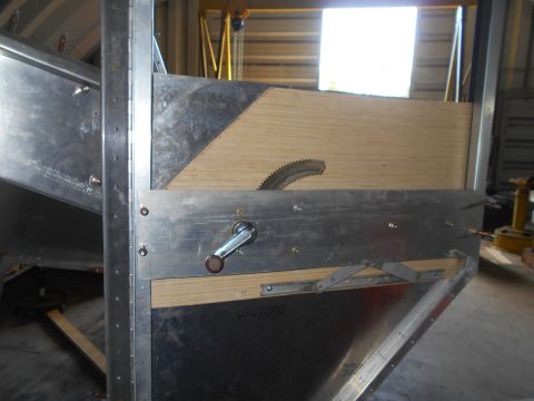1992 Ford Bronco - Close-up of a metal cutting jig a saw blade and a hand crank mechanism.
