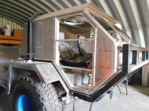 1992 Ford Bronco - This custom vehicle is in the process of being built, with its metal bodywork and interior components visible.