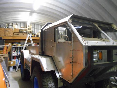 1992 Ford Bronco - This custom truck build is in progress, with visible metalwork and unfinished components.