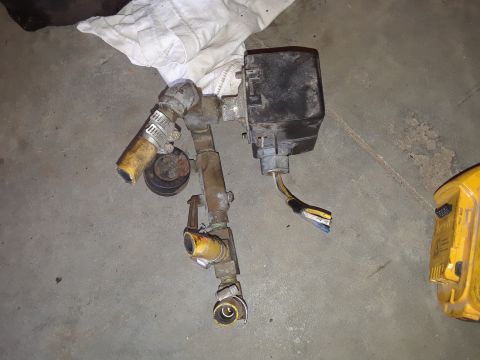 1994 Ford Bronco - An assortment of hoses, valves, and an electrical component are shown, likely a part from a vehicle's system.