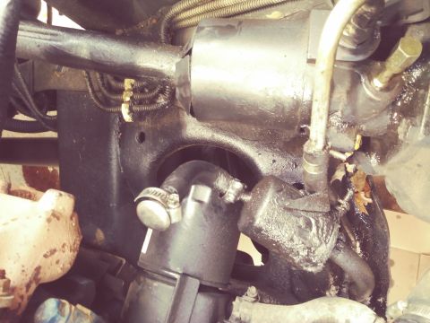 1996 Ford Bronco - Underside view of a vehicle's steering mechanism, showing various hoses and metal components.