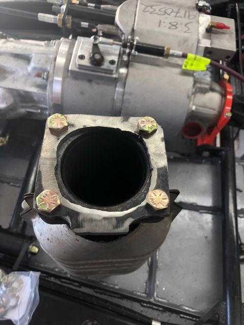 1992 Jeep Wrangler - Bolted exhaust pipe flange, likely part of a vehicle's exhaust system modification.