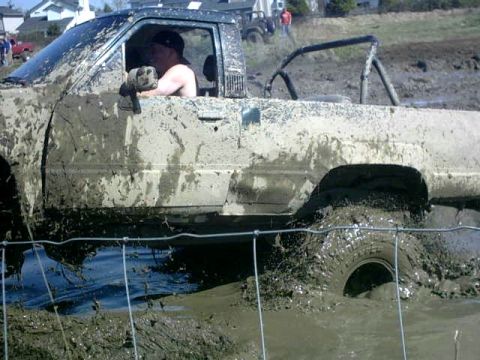 1995 Ford Bronco - Truck stuck deep in mud during a mud bog event.
