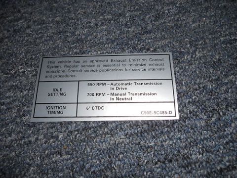 1968 Mercury Cougar - A vehicle emissions control sticker is shown, detailing idle settings and ignition timing.