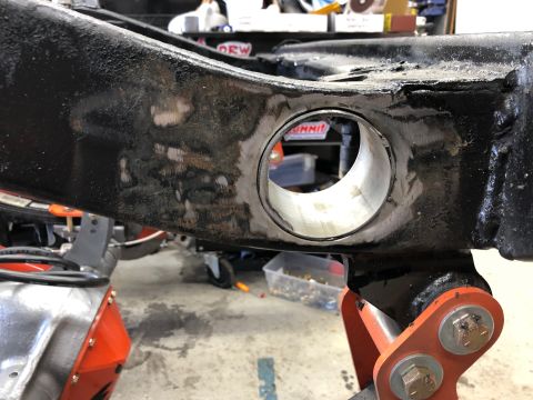 1992 Jeep Wrangler - This image shows a section of a vehicle's frame, likely undergoing repair or modification, with a prominent circular opening.