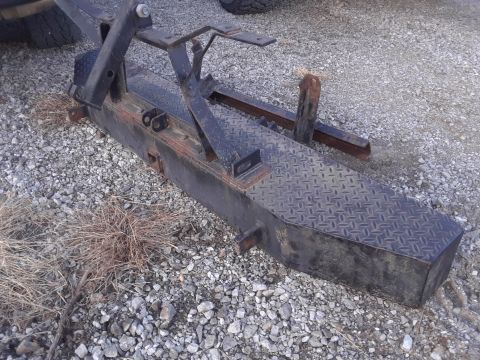 1994 Ford Bronco - A black tow hitch receiver with a diamond plate surface is shown on gravel.