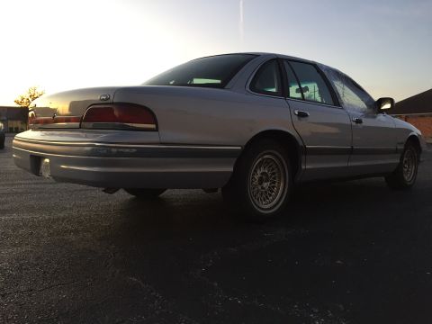 1994 Ford Crown Victoria - Rear view of a 1994 Ford Crown Victoria sedan parked outdoors at dusk.