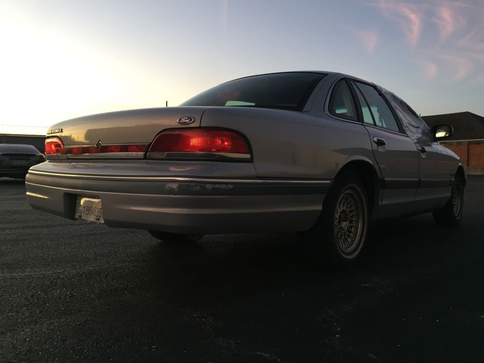 Silver 1994 Ford Crown Victoria rear view. License plate 18840S