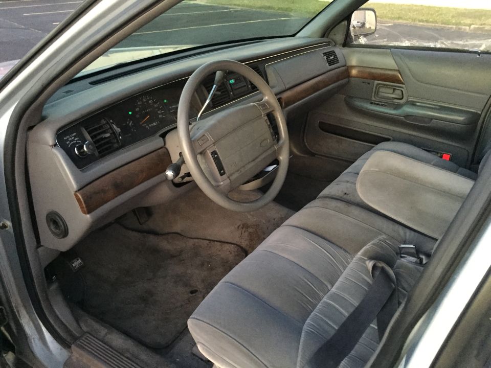 1994 Ford Crown Victoria interior showing dashboard, steering wheel, and front seats
